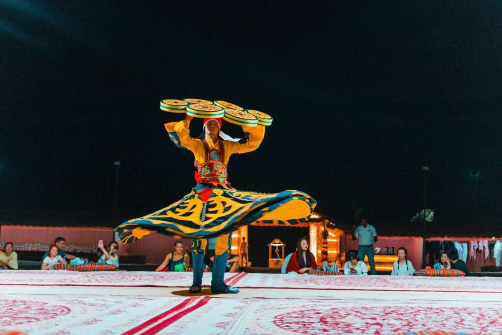 Experience the traditional Tanoura dance during your Evening Desert Safari in Dubai